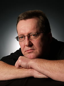 man wearing black polo shirt posing for a photo thumbnail