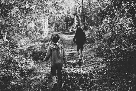grayscale photo of two girl walking on pathway thumbnail