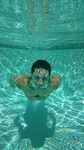 person swimming in pool thumbnail