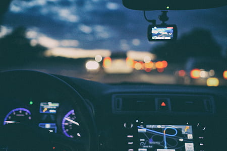 selective focus photo of turned on 2-DIN vehicle stereo head unit displaying map GPS thumbnail