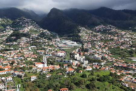 aerial photography of houses near mountains thumbnail