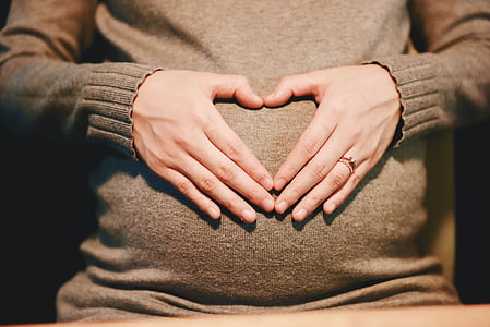 woman wearing brown sweater thumbnail