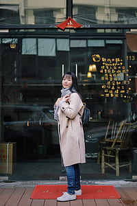 woman standing on the red mat thumbnail
