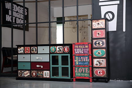 multicolored sideboard beside tallboy dresser thumbnail