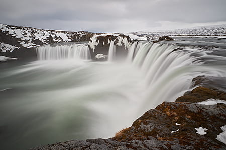 waterfalls under white sky during daytime thumbnail