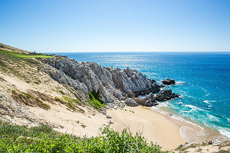 cliff near sea at daytime thumbnail