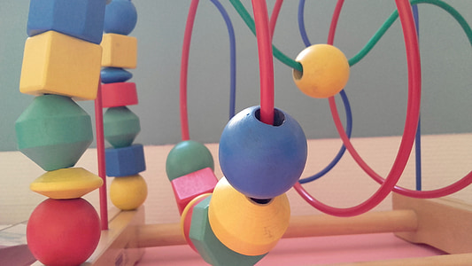 macro shot photography of multicolored cube maze toy thumbnail