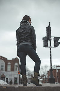 woman standing near traffic light during daytime thumbnail