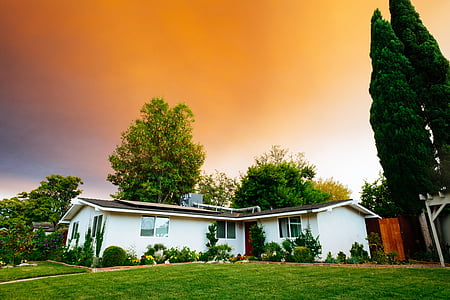 white and brown 1-storey house surrounded by brown sky thumbnail