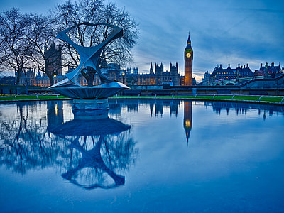 body of water near brown clock tower thumbnail