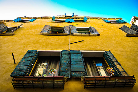 bottom's eye-view of blue wooden door windows thumbnail