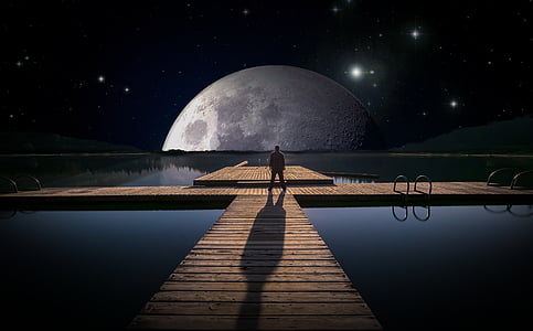 man standing on dock facing moon digital wallpaper thumbnail