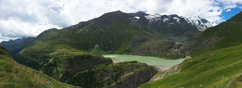 landscape photography of mountains under white clouds thumbnail