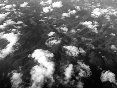 bird's eye view photo of mountains and clouds thumbnail
