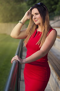 woman holding handrail during daytime thumbnail
