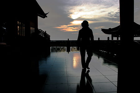 silhouette of person standing on floor thumbnail