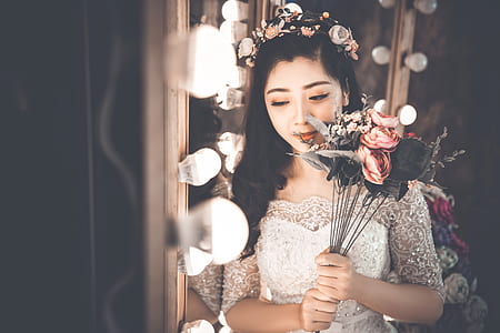 woman wearing white gown beside mirror thumbnail