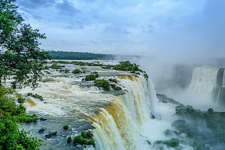 waterfalls near trees at daytime thumbnail
