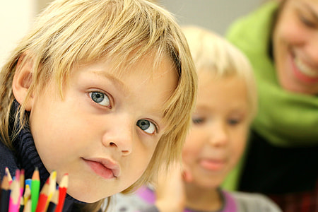 Boy in school classroom with teacher thumbnail