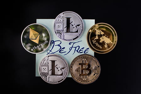 silver-and-gold-colored bit coins thumbnail