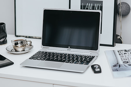 Laptop computer on white desk thumbnail