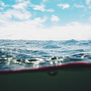 body of water under blue sky at daytime thumbnail