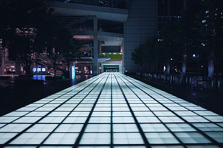 lighted pathway near buildings thumbnail