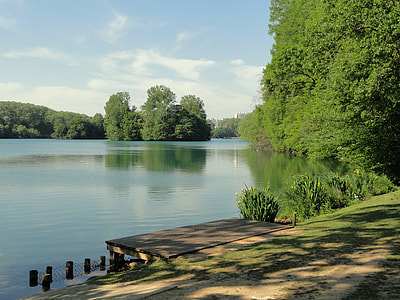 brown wooden dock near body of water at daytime photo thumbnail