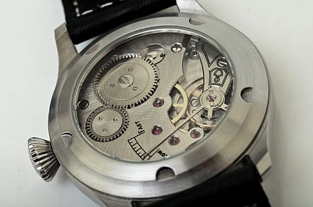 round silver-colored skeleton watch with black leather strap thumbnail