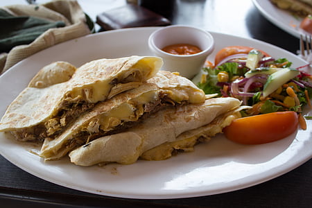 cooked pancake with vegetables on white ceramic plate close-up photo thumbnail