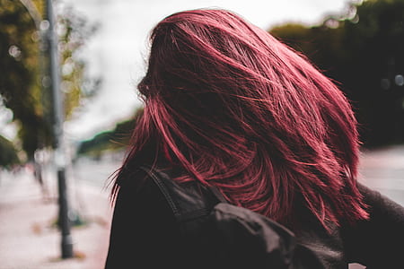 tilt shift view of woman red hair thumbnail