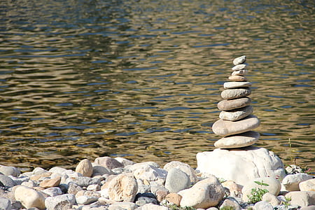 white rock formation near body of water thumbnail