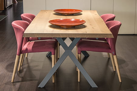 photo of two brown ceramic plates on dining table with chairs thumbnail