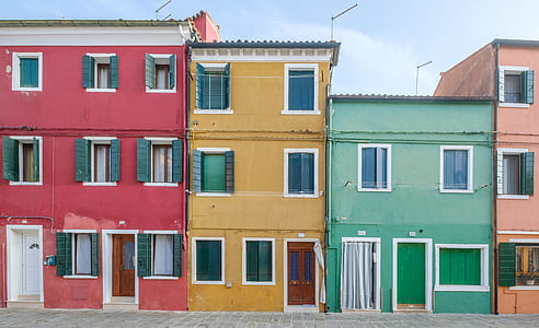 assorted-color houses during daytime thumbnail