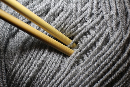 grey yarn with wooden needls thumbnail