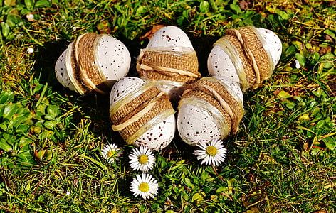 five white Easter eggs on the ground thumbnail