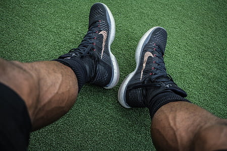 person wearing black Nike basketball shoes thumbnail