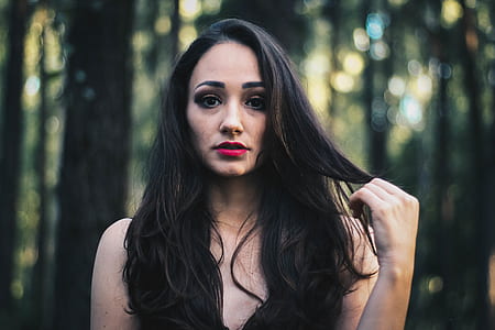 woman standing on forest thumbnail