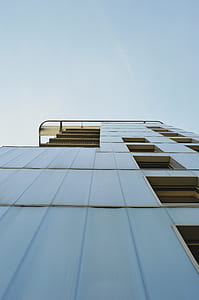 white concrete building under clear sky thumbnail