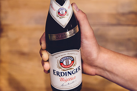 person holding Erdinger wine bottle thumbnail