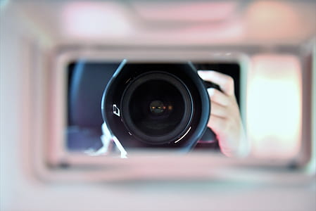 person holding camera thumbnail