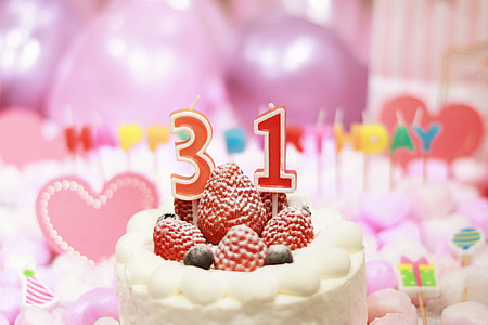 focus photography of birthday cake with raspberries and 31 candle thumbnail