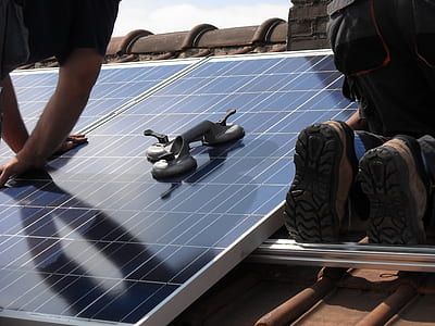 person holding solar panel board thumbnail
