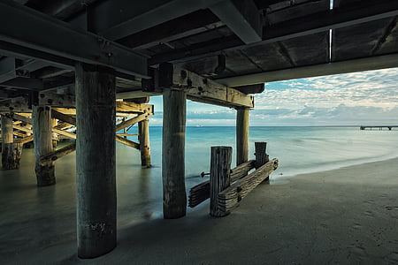 brown wooden dock on beach thumbnail