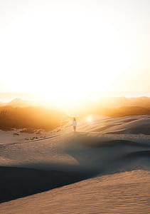 woman standing in the middle of desert thumbnail