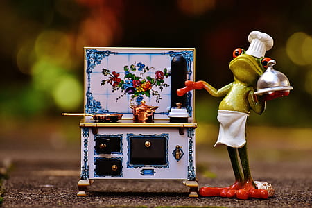 green frog holding gray stainless steel plate with lid figurine thumbnail