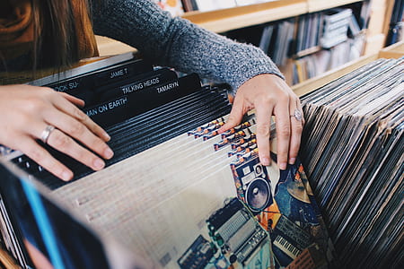 woman filing record sleeves thumbnail