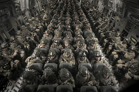 photo of soldiers riding in cargo plane thumbnail