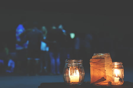 selective focus photography of lighted candles in jar thumbnail