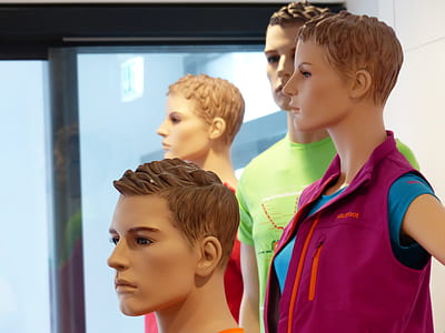 several mannequins near glass window thumbnail
